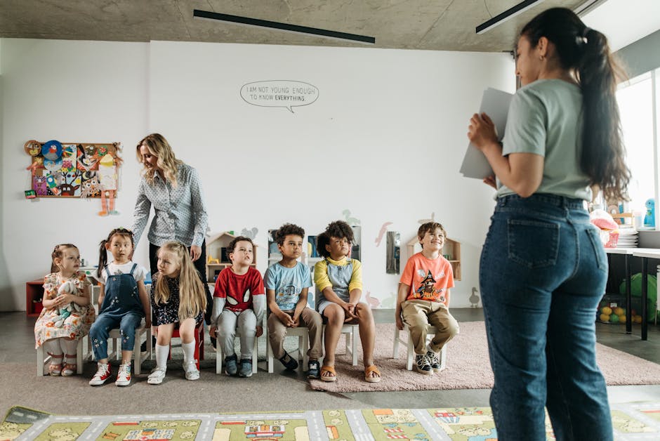 Diverse group of preschool children and teachers in an engaging classroom setting.